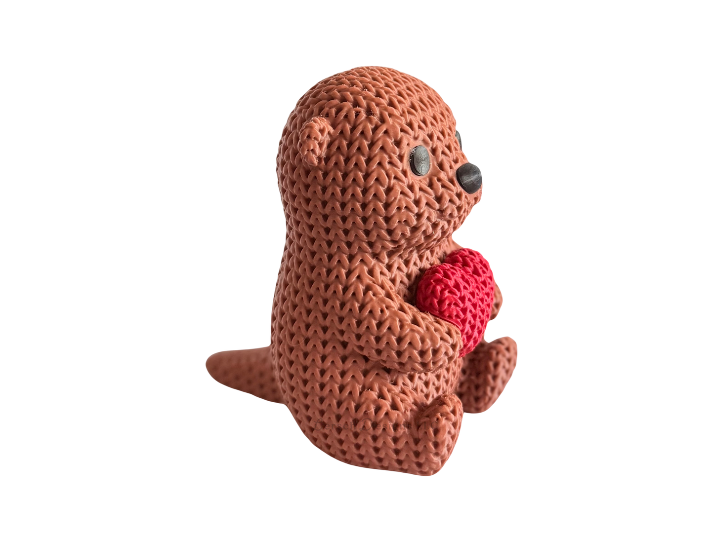 Knitted Otter Holding Heart